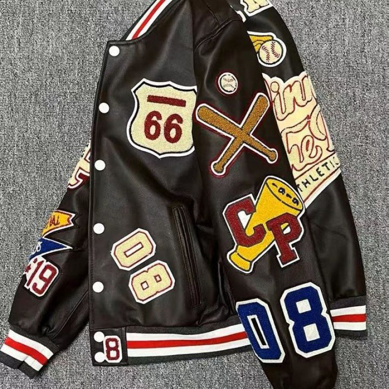 Angled view of a black varsity jacket with colourful baseball-inspired patches and striped cuffs and hem
