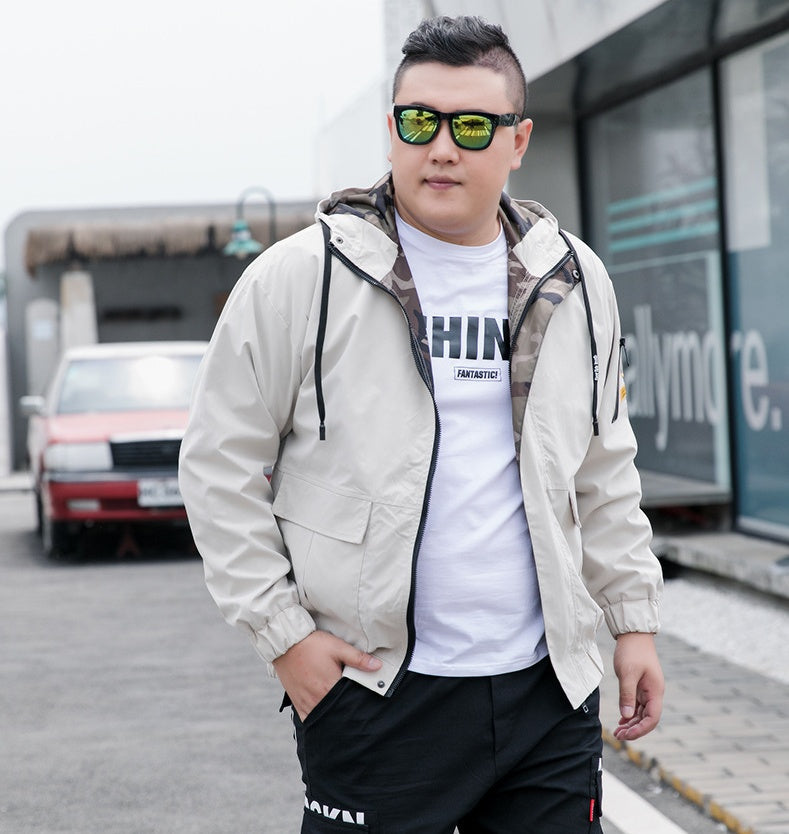 Khaki hooded utility jacket worn open to show the camouflage inner facing
