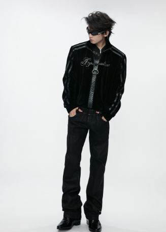 Black ring-zip gothic jacket styled with black trousers and boots on a model
