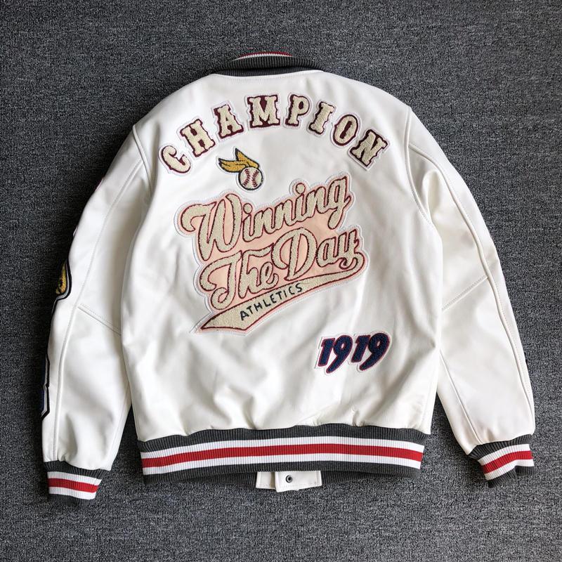 Back view of a white varsity jacket with large lettering, a baseball motif and striped ribbed hem
